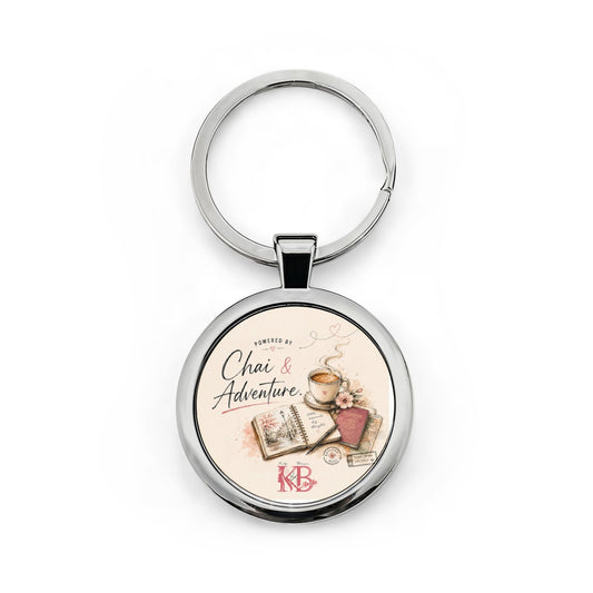 Chai & Adventure Round Stainless Steel Keychain — Travel Mug, Book & Tea Lover Gift