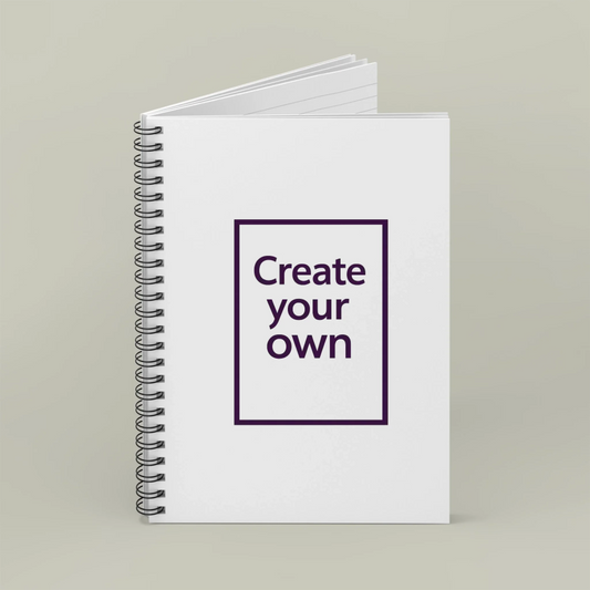Notebook with 'Create your own' text on a plain background