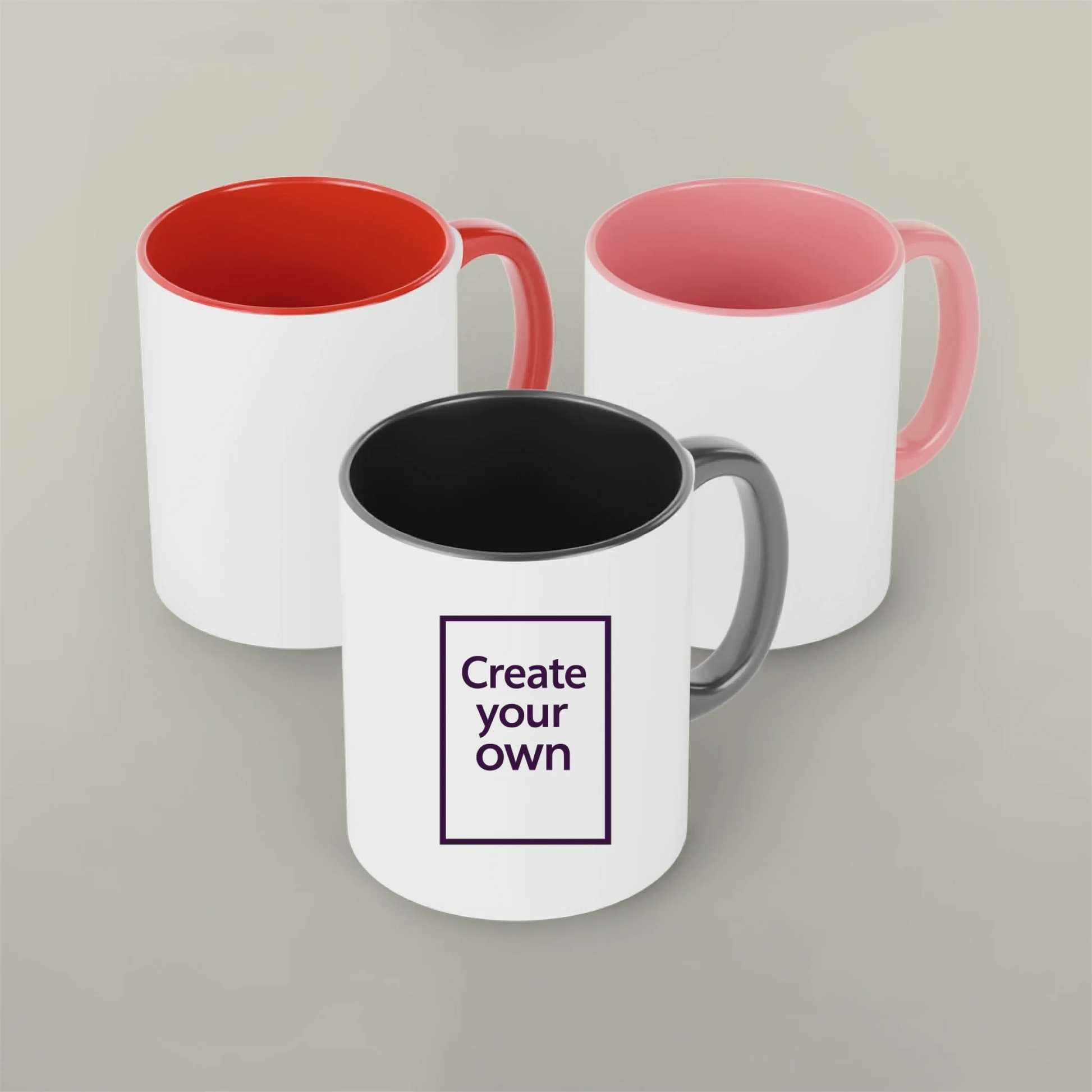Three customizable mugs with different color options on a gray background.